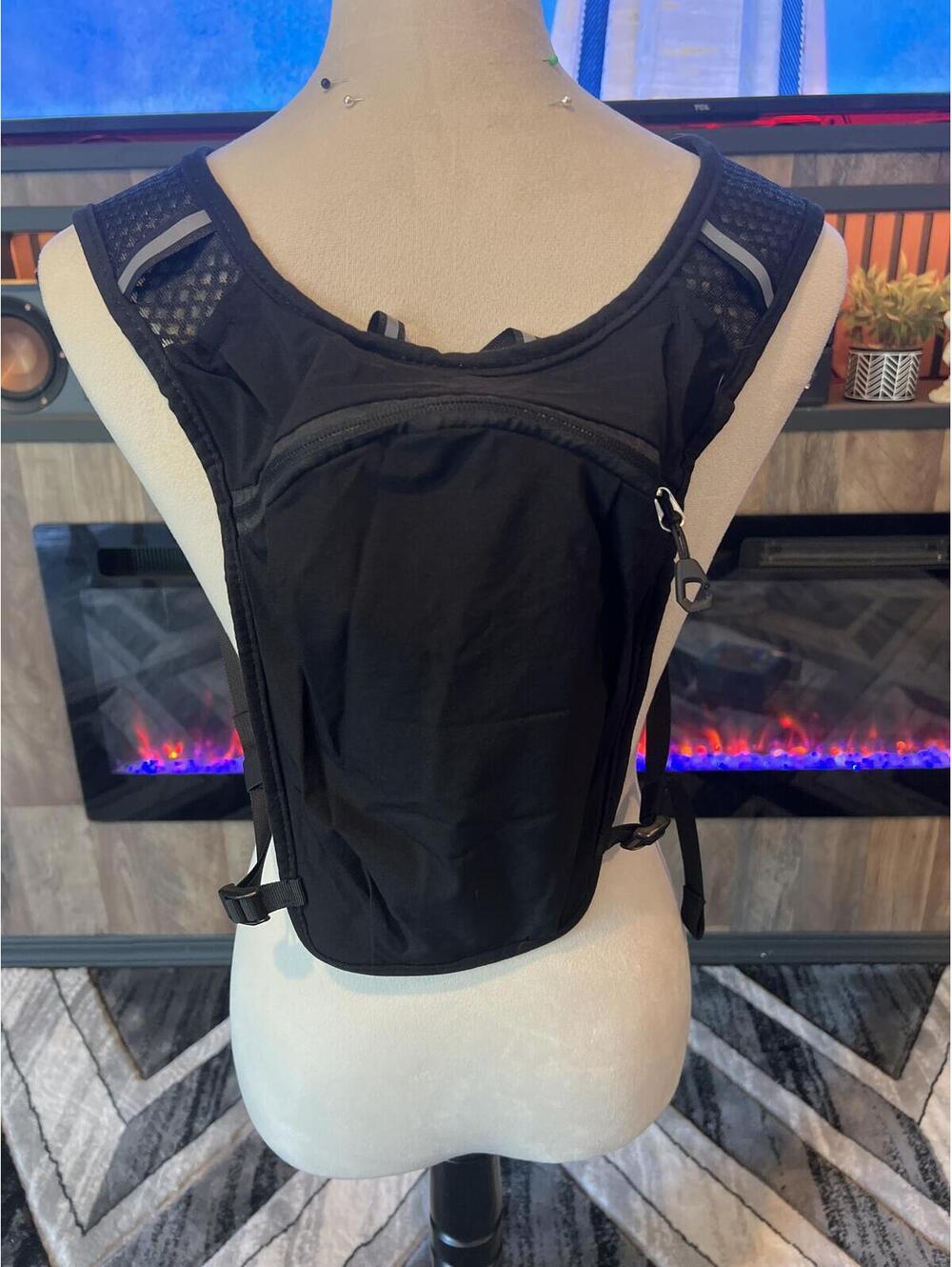 Black Hydration Vest Backpack with Adjustable Straps and Zipper Pockets